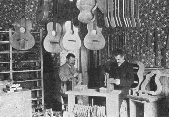 Mozzani's
                        shop, 1906, with cutaway guitars!