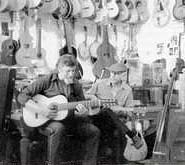 Marc attempts the blues on an 8-string classical made by Eugene Clark, to his left